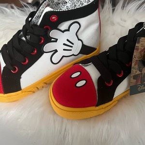 Mickey Mouse sneakers with tags.